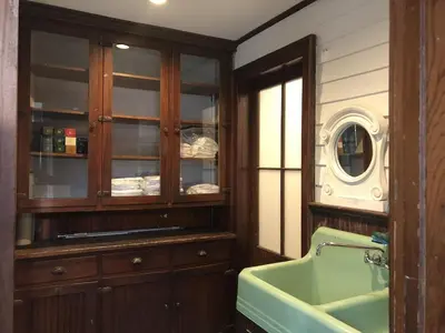 a bathroom with a sink and a mirror at Hudson Valley Retreat in Downtown Hudson, NY - Sleeps 16-20 in Hudson