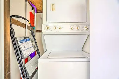an open refrigerator with a washer and dryer at Tobyhanna Home Near Kalahari with Lake and Pool Access in Tobyhanna