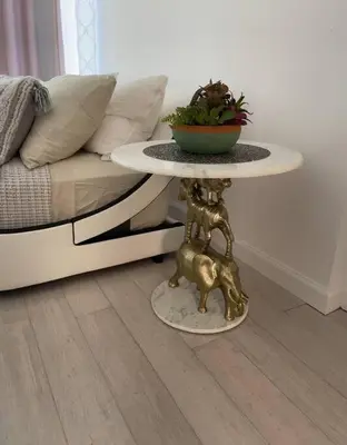 a table with a dog on it next to a couch at Luxury Suite with water view - 2 mini bedrooms in Greenwich
