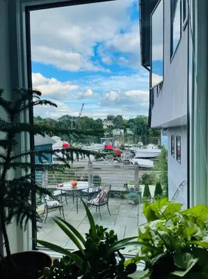 a view from a window of a patio with a table and chairs at Luxury Suite with water view - 2 mini bedrooms in Greenwich