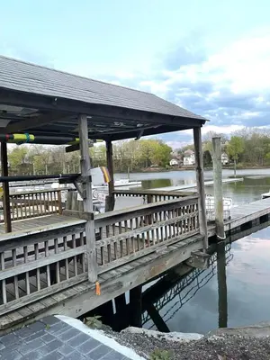 a wooden bridge over a body of water at Luxury Suite with water view - 2 mini bedrooms in Greenwich