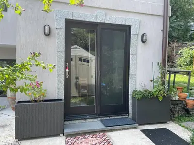 an entrance to a house with a glass door at Luxury Suite with water view - 2 mini bedrooms in Greenwich