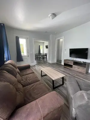 a living room with a couch and a table at Triple Play Apt 2 All Star Baseball Rentals in Oneonta