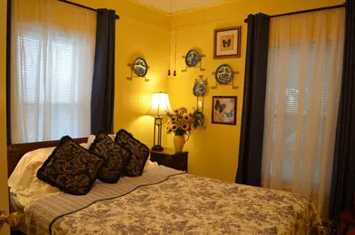 a bedroom with a bed with pillows on it at The Bavarian Manor Hotel in Purling