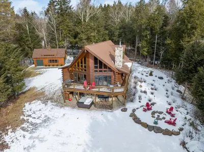 an overhead view of a log cabin in the snow at Beautiful Chalet, mins to Hunter/Windham slopes in Jewett