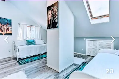 a white room with a bed and a couch at Majesty mountains The Great spirit of Wakan Tanka in Vernon Township