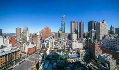 an aerial view of a city with tall buildings at Tribeca 1BR w Gym Doorman Valet NYC-51 in New York