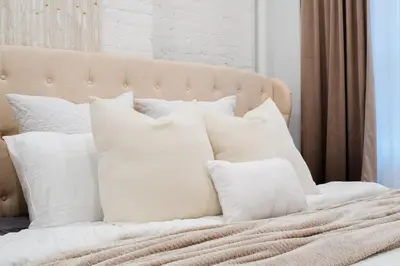 a pile of white pillows on a bed at 1288-4R Newly furnished Prime UES 2BR in New York