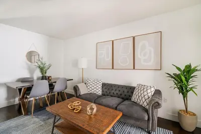 a living room with a couch and a table at 39-2 Renovated 3BR Prime Hudson Yards Area in New York