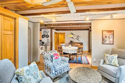 a living room with a table and chairs and a dining room at Berkshires Getaway Less Than 1 Mi Skiing and Hiking! in Shelburne Falls