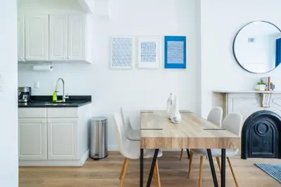 a kitchen and dining room with a table and chairs at 1435-4 I 3 Bedrooms 2Bath W D Prime Upper east in New York