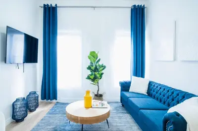 a living room with a blue couch and a table at 1435-4 I 3 Bedrooms 2Bath W D Prime Upper east in New York