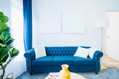 a blue couch sitting in a living room at 1435-4 I 3 Bedrooms 2Bath W D Prime Upper east in New York