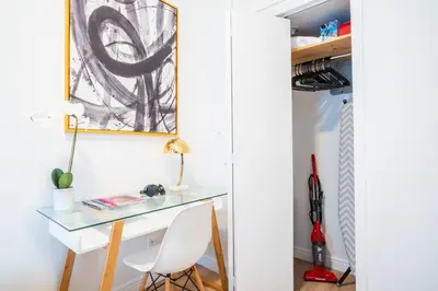 a desk and chair in a room with a closet at 1435-4 I 3 Bedrooms 2Bath W D Prime Upper east in New York
