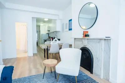 a living room with a mirror and white chairs at 1435-4 I 3 Bedrooms 2Bath W D Prime Upper east in New York