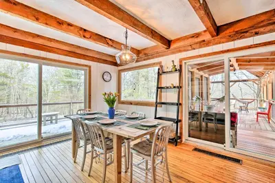 a dining room with a table and chairs at West Cornwall Cabin about 4 Mi to Covered Bridge! in West Cornwall