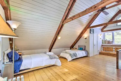 a bedroom with two beds in a attic at West Cornwall Cabin about 4 Mi to Covered Bridge! in West Cornwall