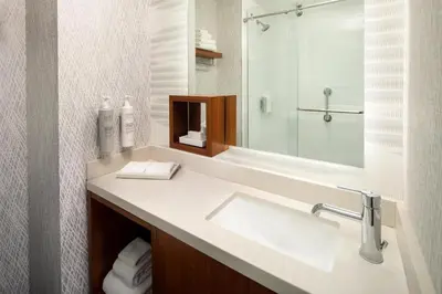 a bathroom with a sink and a mirror at Hampton Inn by Hilton New York Times Square in New York