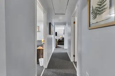 a hallway of a house with white walls at Babe Ruth Apt 2 All Star Baseball Rentals in Oneonta