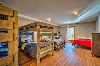 a bedroom with two bunk beds and a bed at Idyllic Mount Snow Condo with View and Amenities! in West Dover