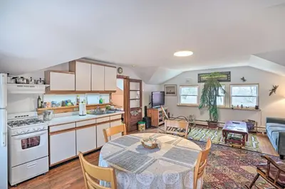 a kitchen and living room with a table and chairs at New York Vacation Rental with Smart TVs and Cable in Saugerties