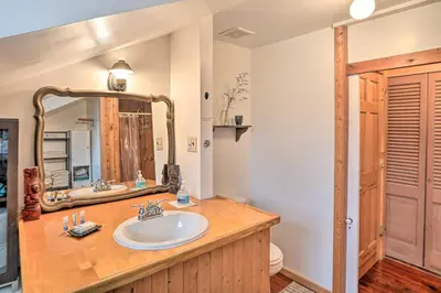 a bathroom with a sink and a mirror at New York Vacation Rental with Smart TVs and Cable in Saugerties