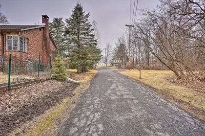 an empty road in front of a house at New York Vacation Rental with Smart TVs and Cable in Saugerties