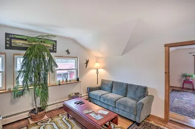 a living room with a couch and a table at New York Vacation Rental with Smart TVs and Cable in Saugerties