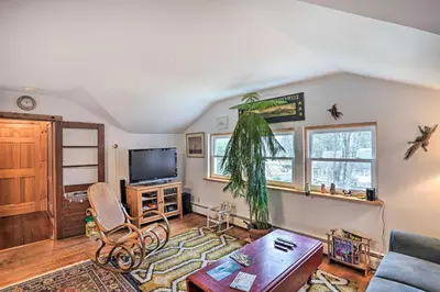 a living room with a couch and a tv at New York Vacation Rental with Smart TVs and Cable in Saugerties