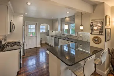 a large kitchen with a large island in a room at Bridgeport Vacation Rental - Walk to Beach! in Bridgeport
