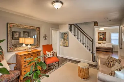 a living room filled with furniture and a mirror at Bridgeport Vacation Rental - Walk to Beach! in Bridgeport