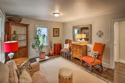 a living room with a couch and chairs and a mirror at Bridgeport Vacation Rental - Walk to Beach! in Bridgeport