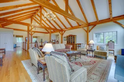 a large living room with wooden ceilings and beams at Luxury Vacation Rental in the Berkshires! in Williamstown