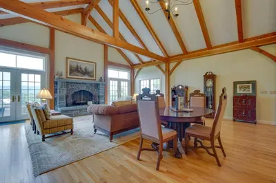 a living room with a table and a couch at Luxury Vacation Rental in the Berkshires! in Williamstown