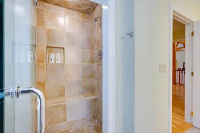 a bathroom with a shower with a glass door at Luxury Vacation Rental in the Berkshires! in Williamstown