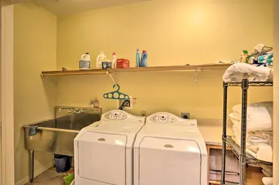 a laundry room with two washes and a sink at Luxury Vacation Rental in the Berkshires! in Williamstown