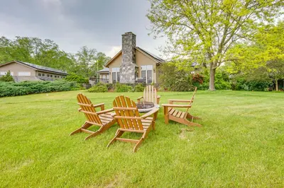 a group of chairs and a table in the grass at Luxury Vacation Rental in the Berkshires! in Williamstown