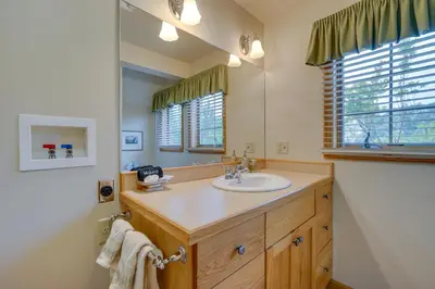 a bathroom with a sink and a mirror at Vacation Rental Home in the Berkshires! in Williamstown