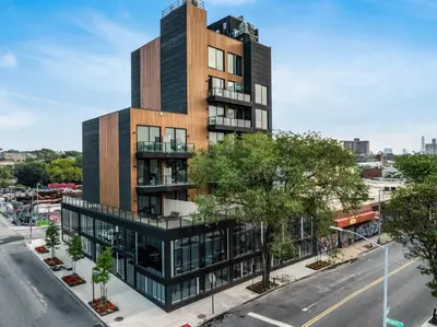 an architectural rendering of a tall building on a city street at Nova Hotel Brooklyn in Brooklyn