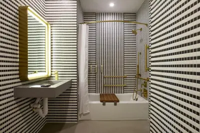 a bathroom with a sink and a shower and a tub at Renaissance New York Harlem Hotel in New York