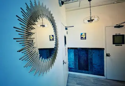 a large mirror on the wall in a room at New York Spirit Retreats HOSTEL in New York