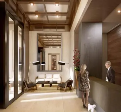 a man and a woman standing in a lobby at Rector Place in New York