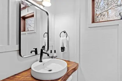 a bathroom with a white sink and a mirror at Maple Pine w Hot Tub Pool Table 3min to Mount Snow in Dover