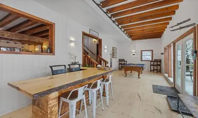 a living room with a large counter and a pool table at Maple Pine w Hot Tub Pool Table 3min to Mount Snow in Dover