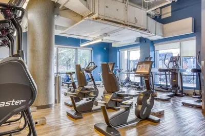 a gym with treadmills and elliptical machines at LIC 1BR w WD Elevator Doorman nr E River NYC-852 in New York