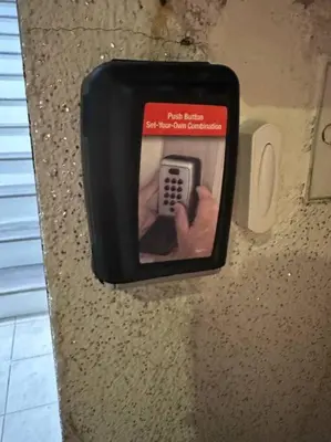 a picture of a hand holding a remote control in a wall at Luxury 3Bed Private Apartment Near Manhattan in New Rochelle