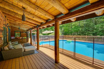 a screened in porch with a pool in the background at Accord Vacation Rental with Pool and Hot Tub! in Accord