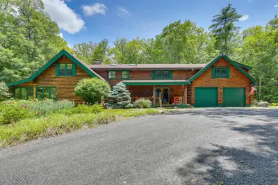 a wooden house with a driveway in front of it at Accord Vacation Rental with Pool and Hot Tub! in Accord