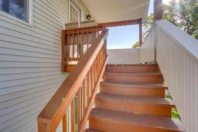 a staircase leading up to a house at Canal-Front Waterford Apartment on Hudson River in Waterford