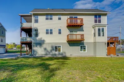 a house with balconies on the side of it at Canal-Front Waterford Apartment on Hudson River in Waterford